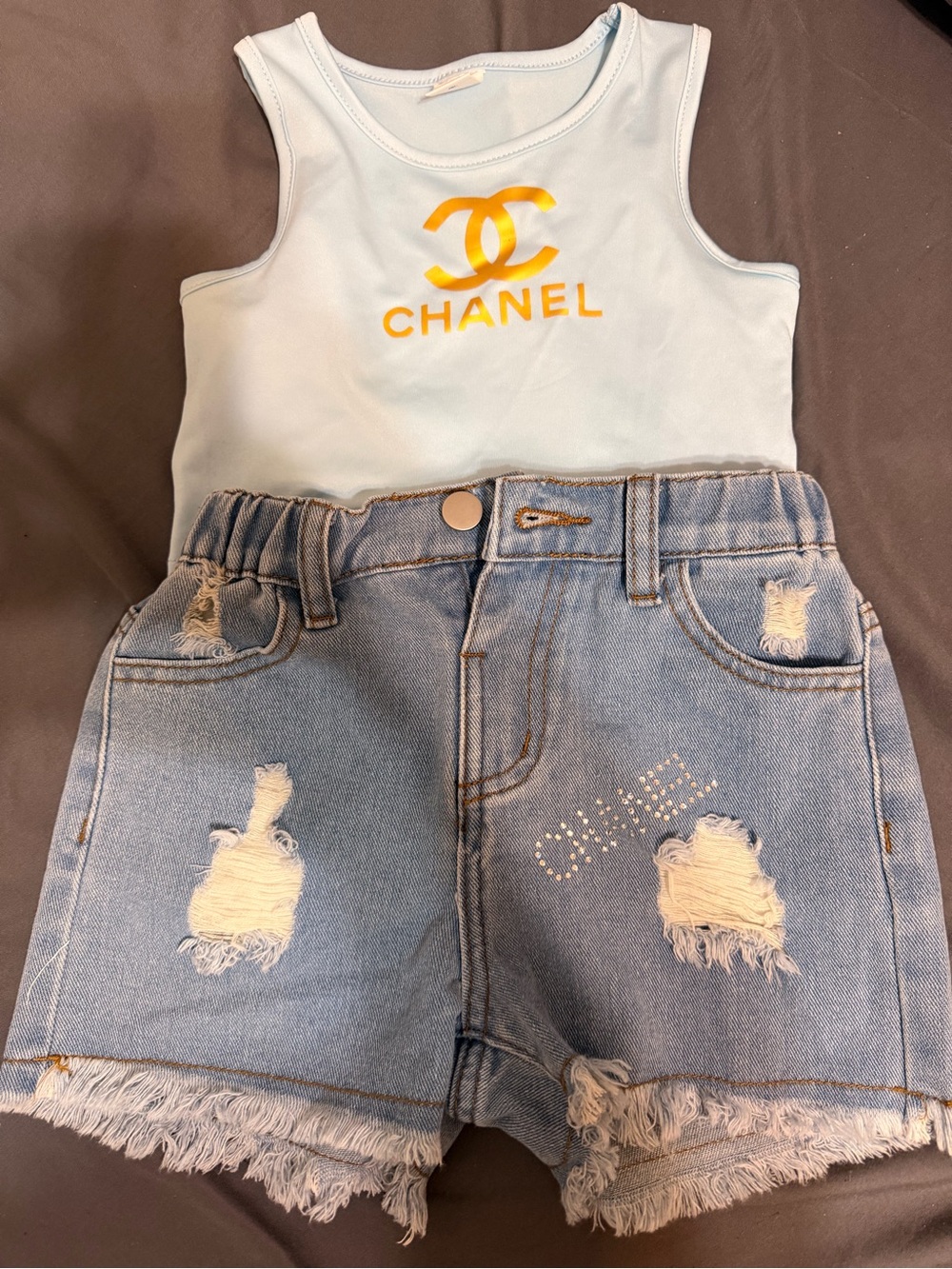 CHANEL White Tank with Yellow Logo and Light Blue Distressed Denim Shorts